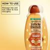 imageGarnier Whole Blends Honey Treasures Repairing Shampoo Hair Repair Formula for Dry Damaged Hair with Acacia Manuka and Lavender Honeys 28 Fl Oz Packaging May Vary28 Fl Oz Pack of 1